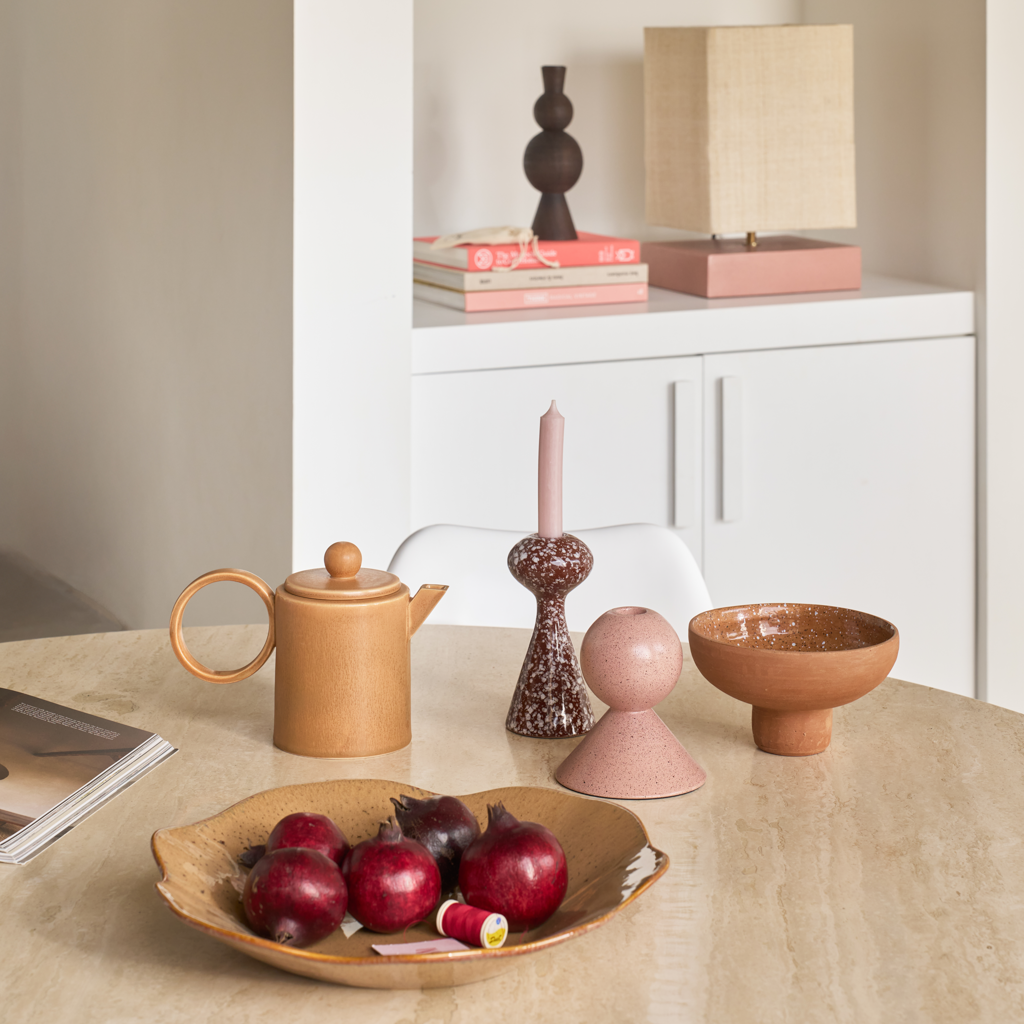 A small teapot for two cups with a refined, contemporary look, finished in a matt reactive mid- brown glaze, featuring a large rounded handle. Made from a balanced mix of recycled and virgin ceramics.
