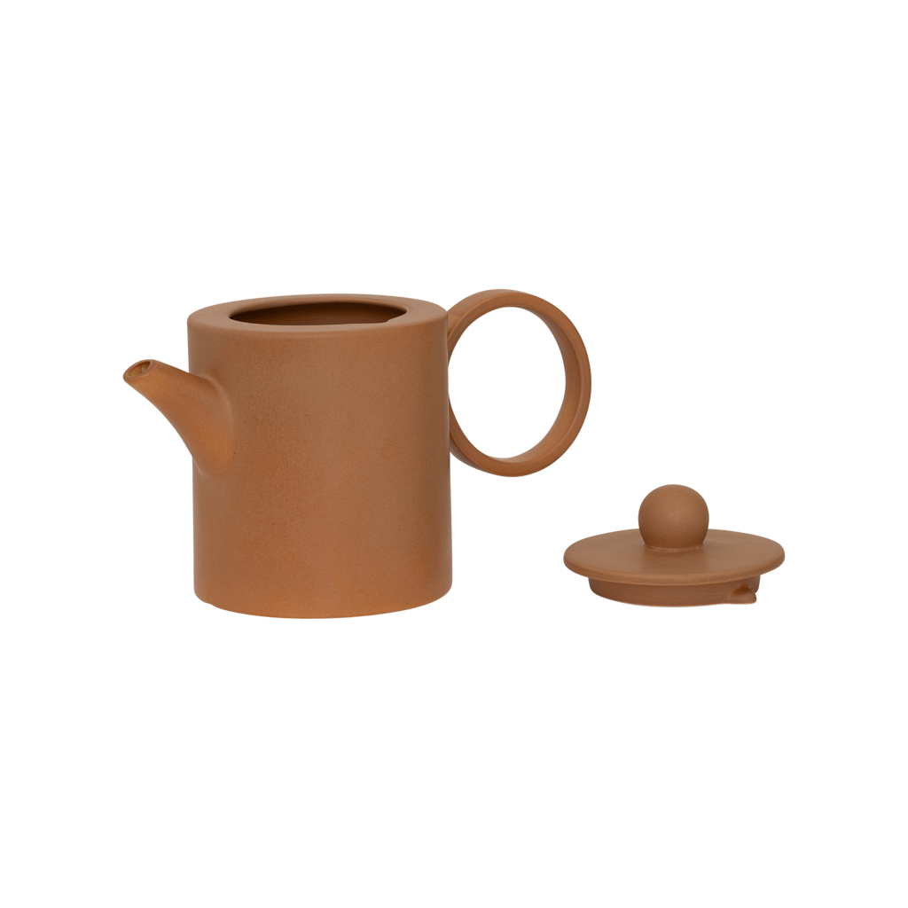 A small teapot for two cups with a refined, contemporary look, finished in a matt reactive mid- brown glaze, featuring a large rounded handle. Made from a balanced mix of recycled and virgin ceramics.