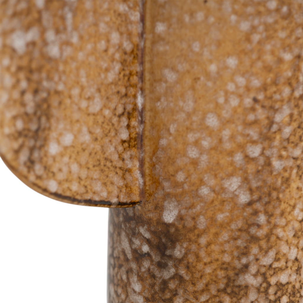 A small bodied vase featuring two organically shaped half-circle ears on the sides, finished in a lively brown shiny reactive glaze with outspoken tonal variation. Made from a balanced mix of recycled and virgin ceramics. One-flower vase.