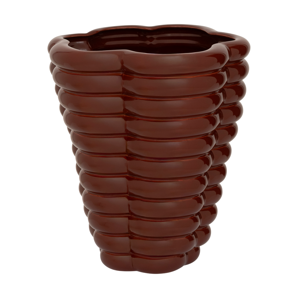 A sculpted, layered and bulky ceramic vase in the deep and rich shiny solid colour brandy, creating a bold and grounded presence. Statement piece