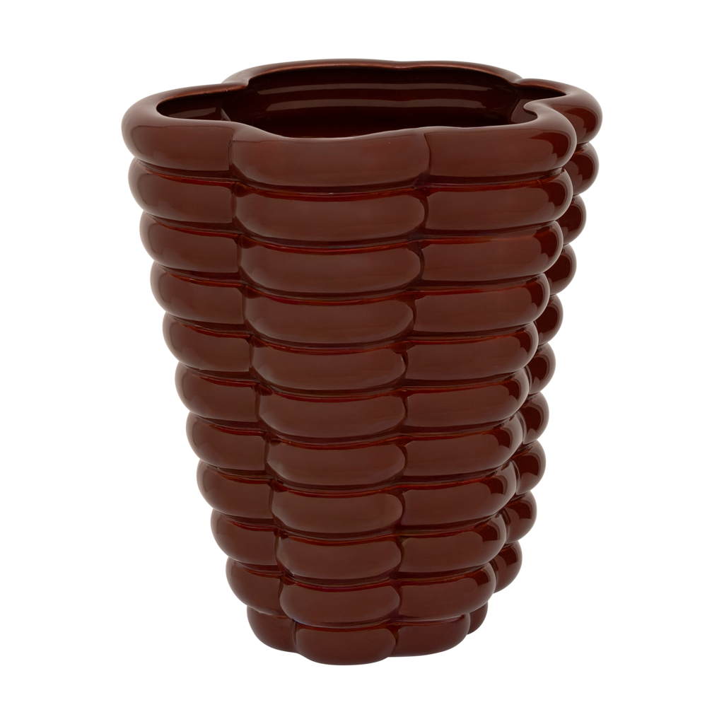 A sculpted, layered and bulky ceramic vase in the deep and rich shiny solid colour brandy, creating a bold and grounded presence. Statement piece