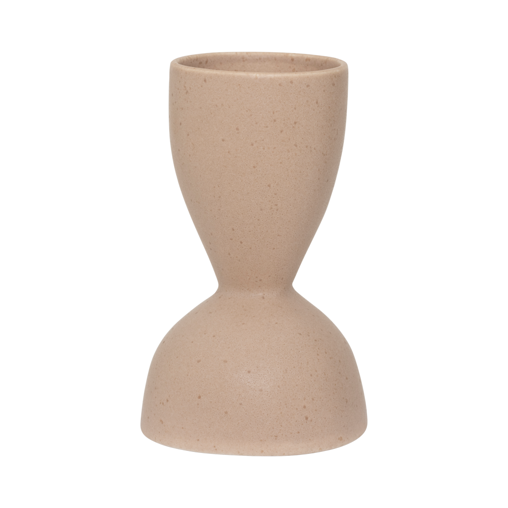 A ceramic vase with a graceful, feminine silhouette and a subtle indentation, finished in the soft natural colour rose smoke. Refined matt reactive glaze.