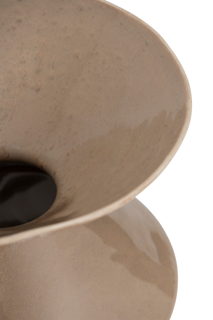 A round ceramic vase featuring indentations that widen in a zigzag rhythm, gently battered, in a muted, earthy taupe colour in a shiny reactive glaze.