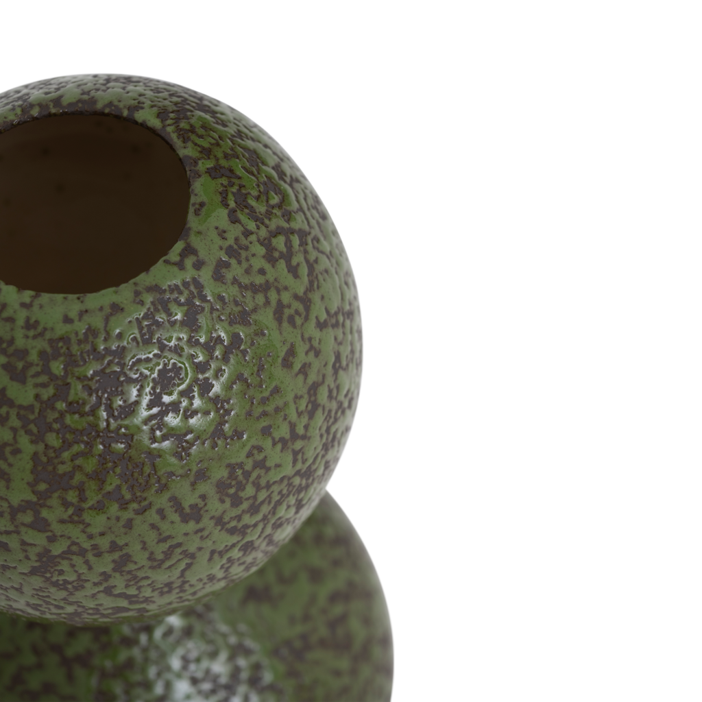 A vase composed of two smoothly stacked, flowing spheres, finished in the rich colour banana palm on a darkbrown base, in a reactive glaze. Crafted from a balanced mix of recycled and virgin ceramics.