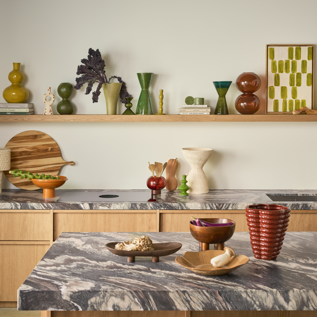A vase composed of two smoothly stacked, flowing spheres, finished in the rich colour banana palm on a darkbrown base, in a reactive glaze. Crafted from a balanced mix of recycled and virgin ceramics.