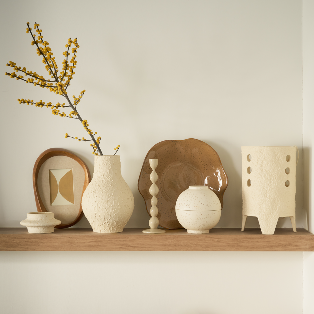 Flowing feminine design vase, made from ceramic with a matt spatulated tactile surface in the colour almond milk.