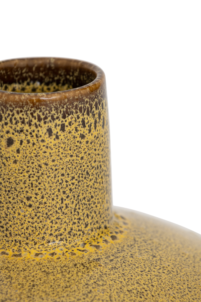 A big bold, flattened round ceramic vase with a small straight neck, featuring an artful shiny reactive glaze in the rich mustard like colour. Statement piece.