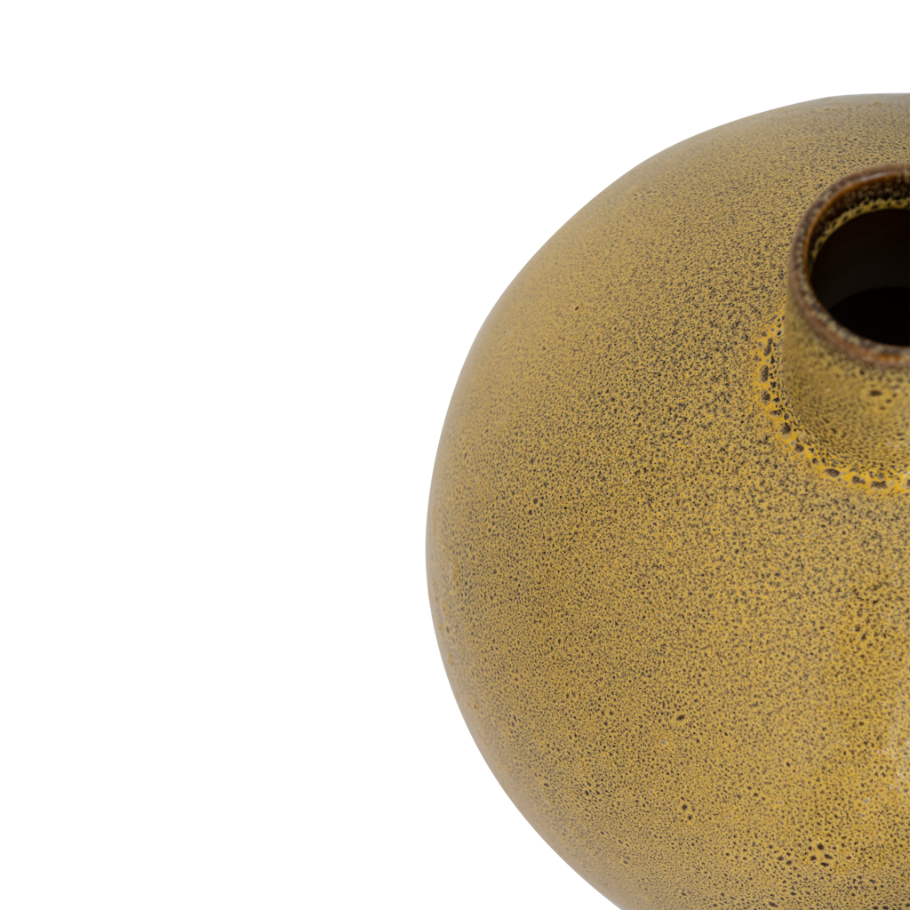 A big bold, flattened round ceramic vase with a small straight neck, featuring an artful shiny reactive glaze in the rich mustard like colour. Statement piece.