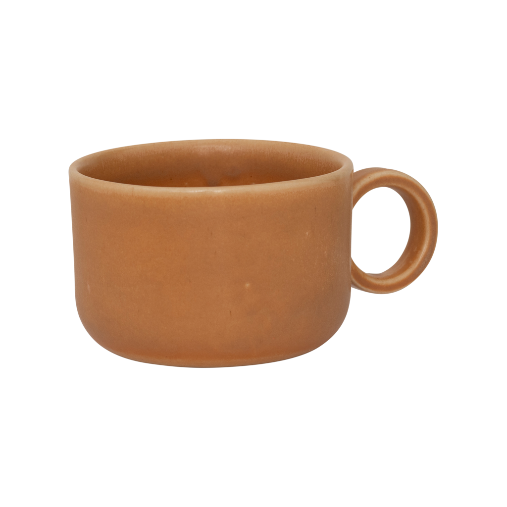 A ceramic mug in mid-brown in a reactive glaze with a large rounded handle, giving it a sculptural, contemporary look. Made from a balanced mix of recycled and virgin ceramics.