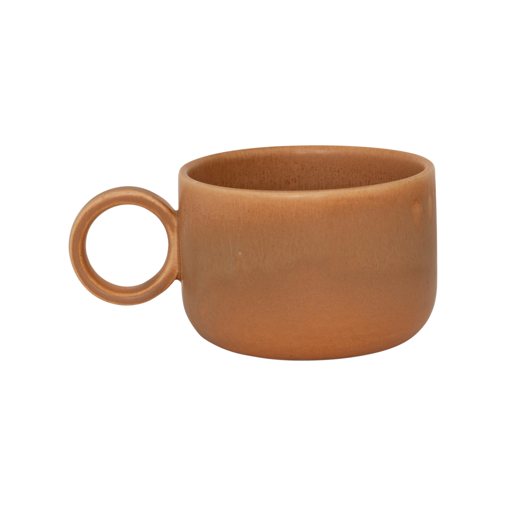 A ceramic mug in mid-brown in a reactive glaze with a large rounded handle, giving it a sculptural, contemporary look. Made from a balanced mix of recycled and virgin ceramics.