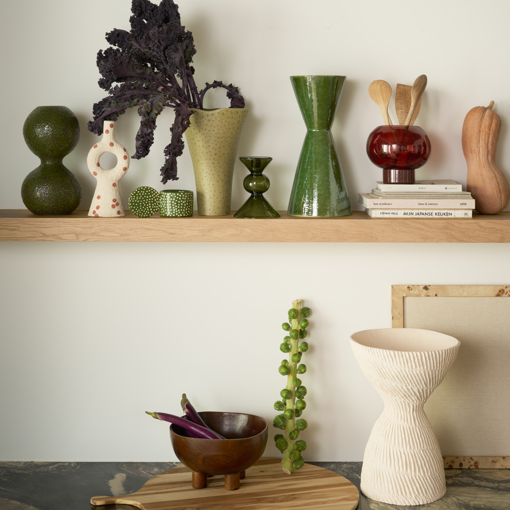 A modern, ceramic vase with a clean, angular shape in the eyecatching colour banana palm, finished with a shiny reactive glaze.