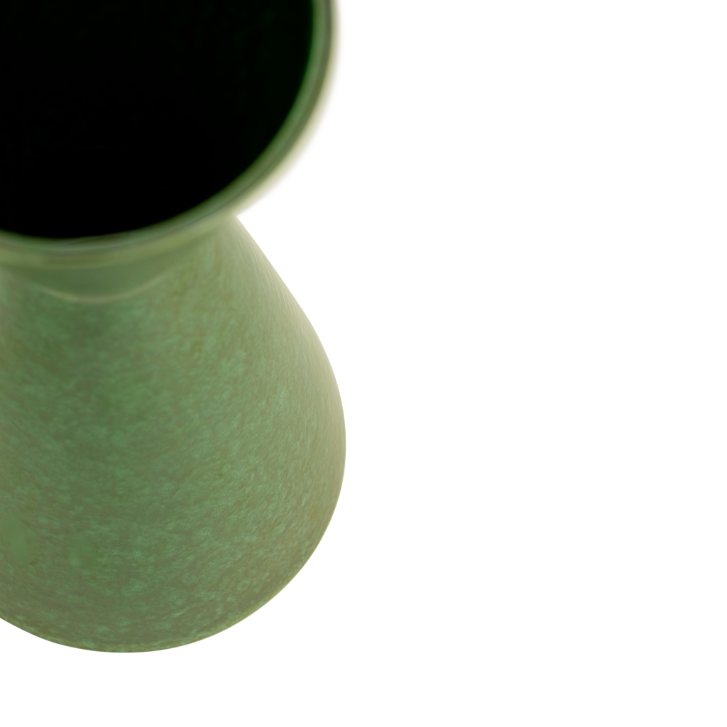 A modern, ceramic vase with a clean, angular shape in the eyecatching colour banana palm, finished with a shiny reactive glaze.