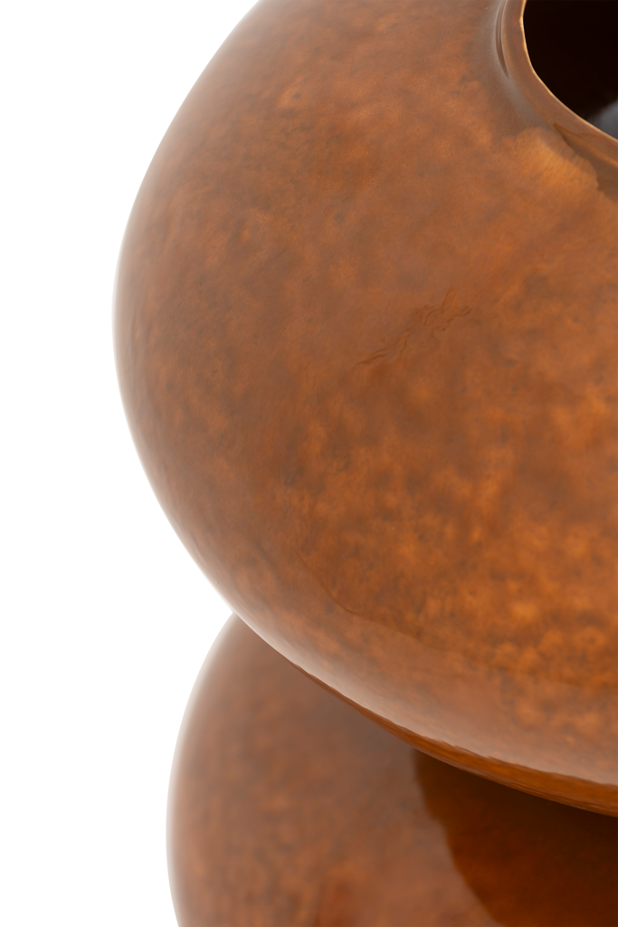 A generous, playful ceramic vase composed of two stacked spheres in a warm, inviting colour sugar almond, finished with a shniy reactive glaze. Full of organic charm, perfect as a statement piece.