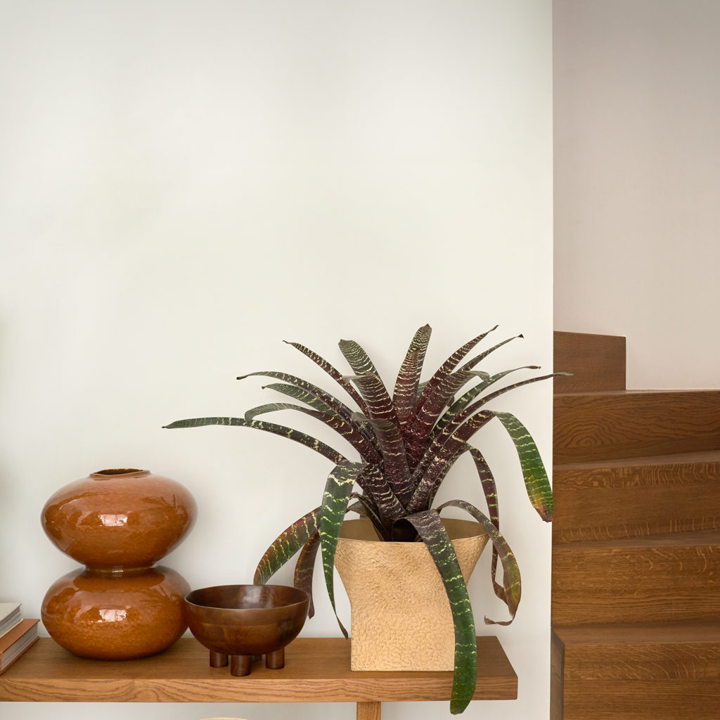 A generous, playful ceramic vase composed of two stacked spheres in a warm, inviting colour sugar almond, finished with a shniy reactive glaze. Full of organic charm, perfect as a statement piece.