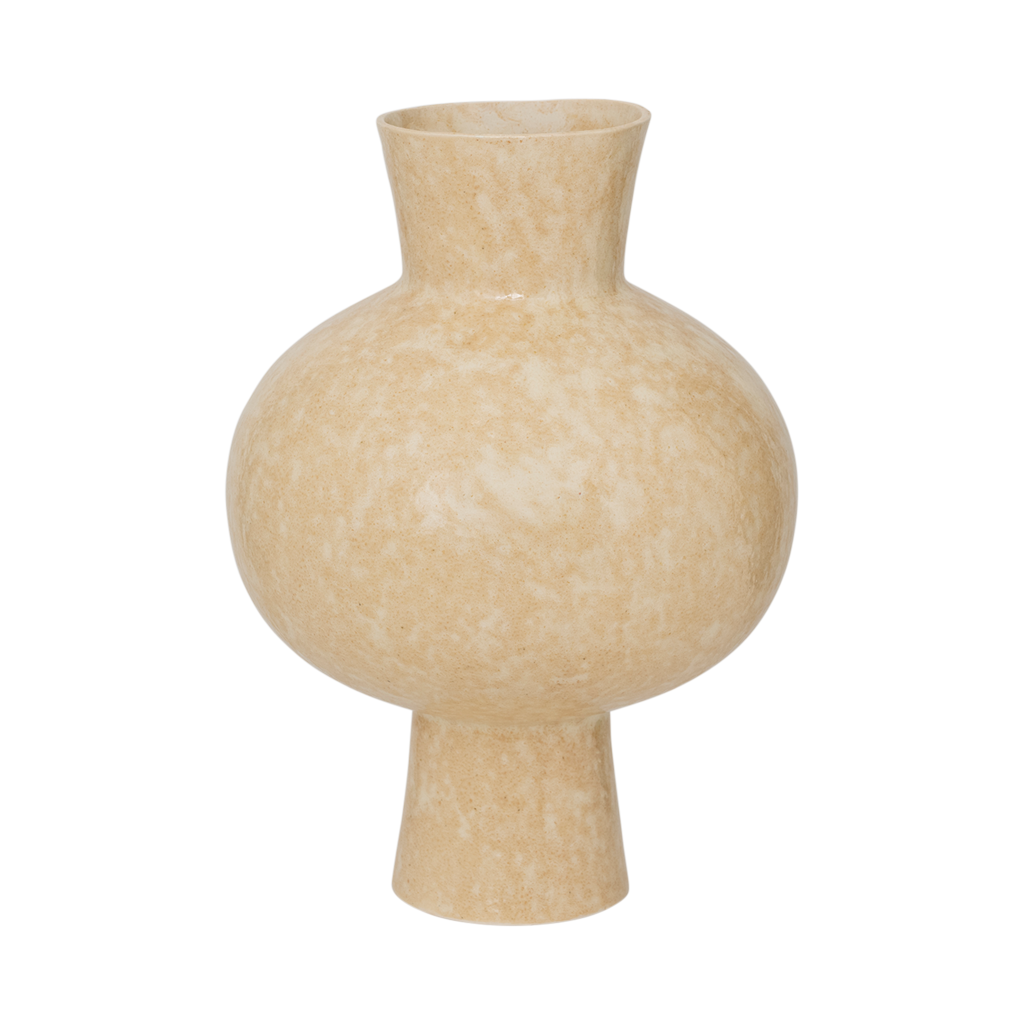 An expressive organically shaped design ceramic vase in a subtile shiny reactive glaze, presented in the natural, muted shade of pale khaki.