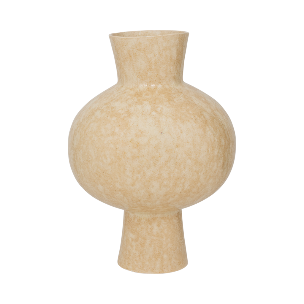 An expressive organically shaped design ceramic vase in a subtile shiny reactive glaze, presented in the natural, muted shade of pale khaki.