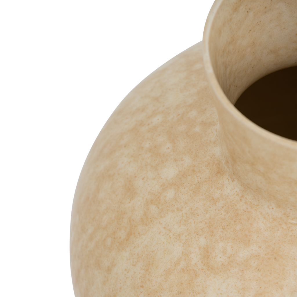 An expressive organically shaped design ceramic vase in a subtile shiny reactive glaze, presented in the natural, muted shade of pale khaki.