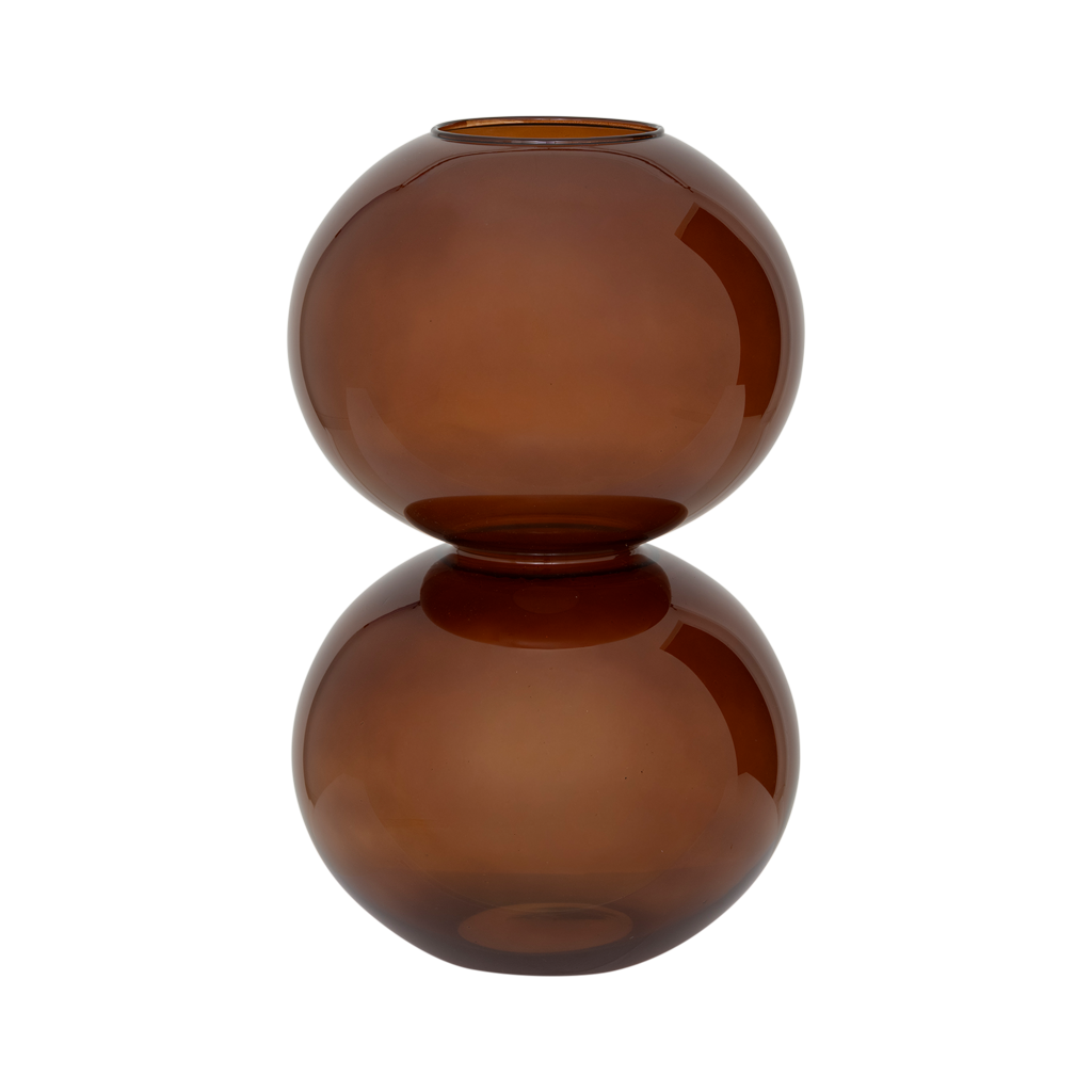 A large recycled glass vase with two layered spherical forms, balanced in the inviting and warm sugar almond colour. Transparant coloured.