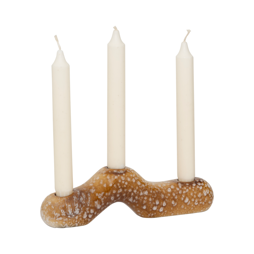 A horizontal candleholder for three candles - organic design. Made from a balanced mix of recycled and virgin ceramics. Finished in a lively brown shiny reactive glaze with outspoken tonal variation.