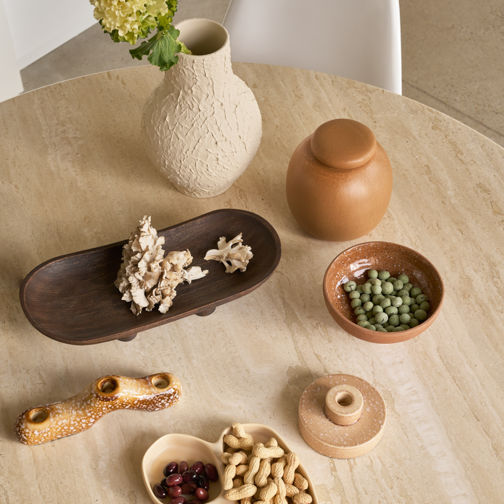 A two-layer candleholder made from a balanced mix of recycled and virgin ceramics, with a straight, minimal form in beige subtile shiny reactive glaze.