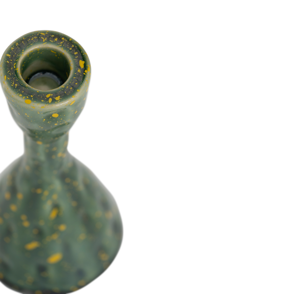 A handmade organically shaped candleholder, made from a balanced mix of recycled and virgin ceramics. An expressive reactive glaze in a vibrant banana palm colour.