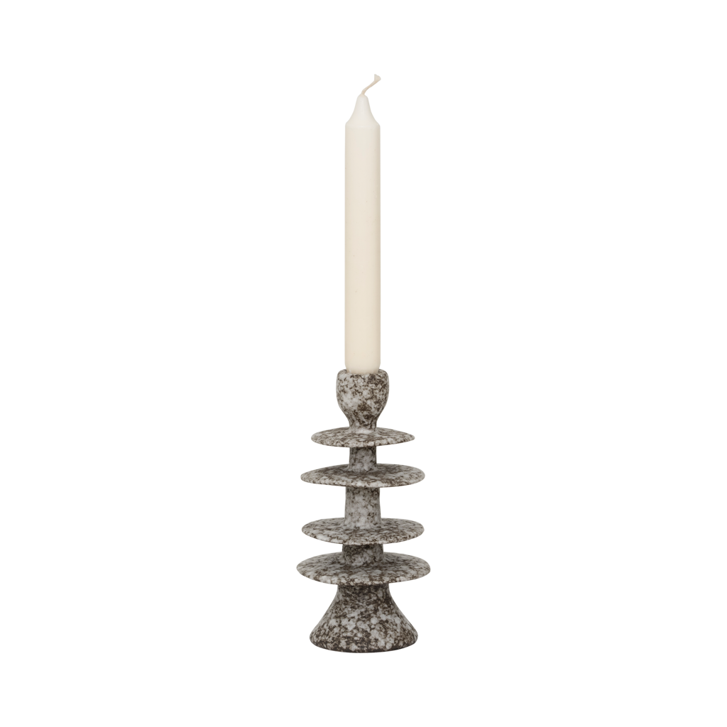 A candleholder in an expressive reactive glaze in a downtown brown colour, composed of layered irregular discs Crafted from a balanced mix of recycled and virgin ceramics.