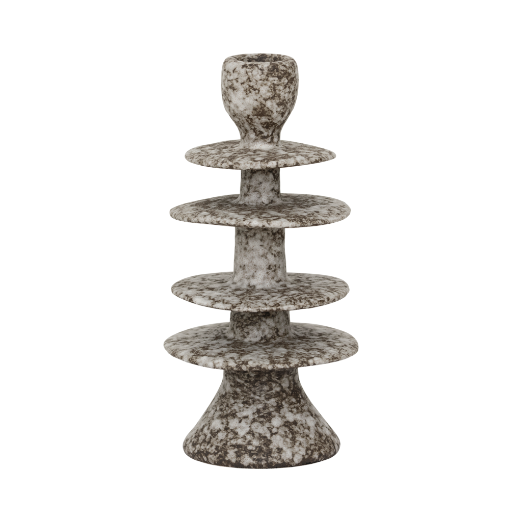 A candleholder in an expressive reactive glaze in a downtown brown colour, composed of layered irregular discs Crafted from a balanced mix of recycled and virgin ceramics.
