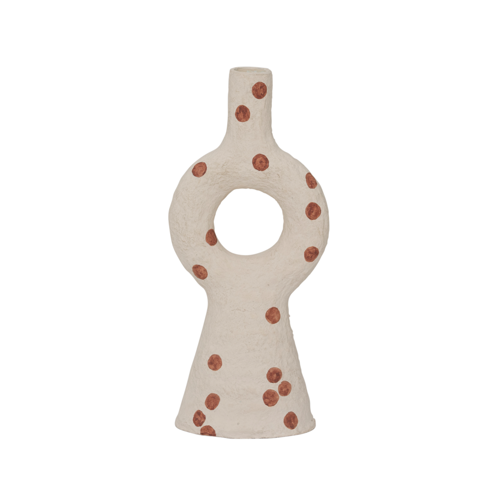 A cotton mache candleholder with an organic and harmonious form. In the soft almond milk colour and decorated with irregular playful dots.