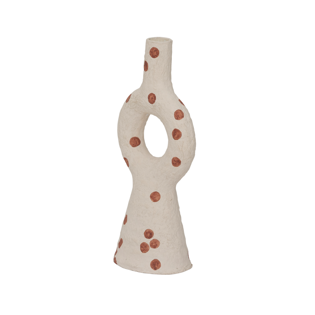 A cotton mache candleholder with an organic and harmonious form. In the soft almond milk colour and decorated with irregular playful dots.