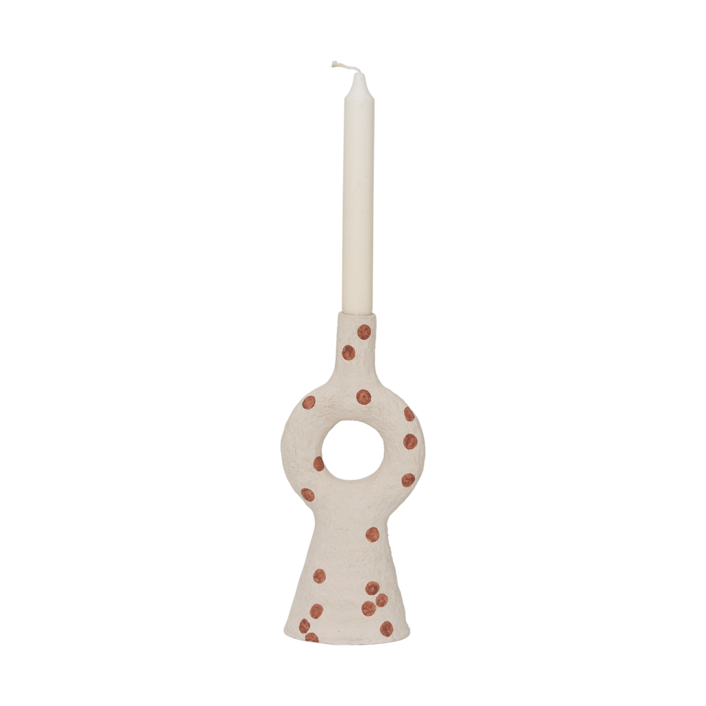 A cotton mache candleholder with an organic and harmonious form. In the soft almond milk colour and decorated with irregular playful dots.