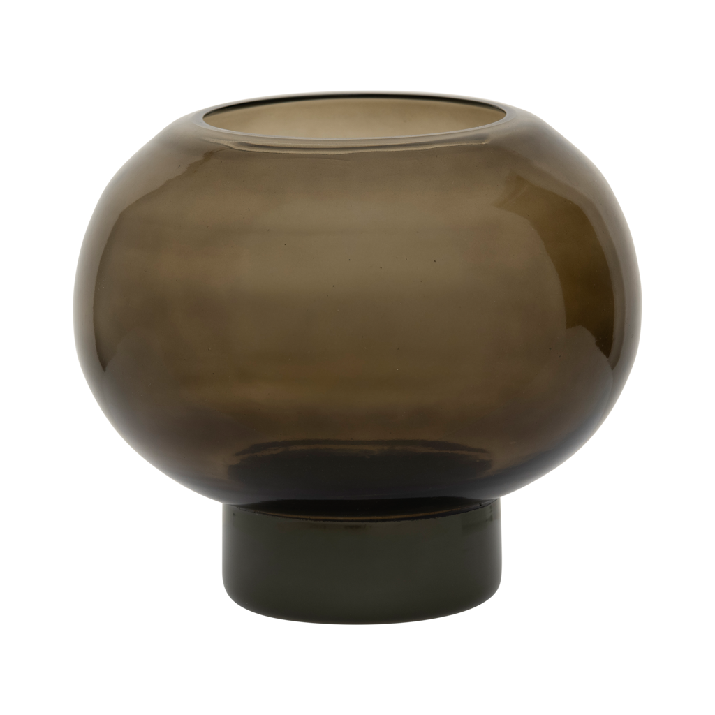 A recycled glass candleholder in deep, earthy kalamata, with a sculptural, graphic shape.