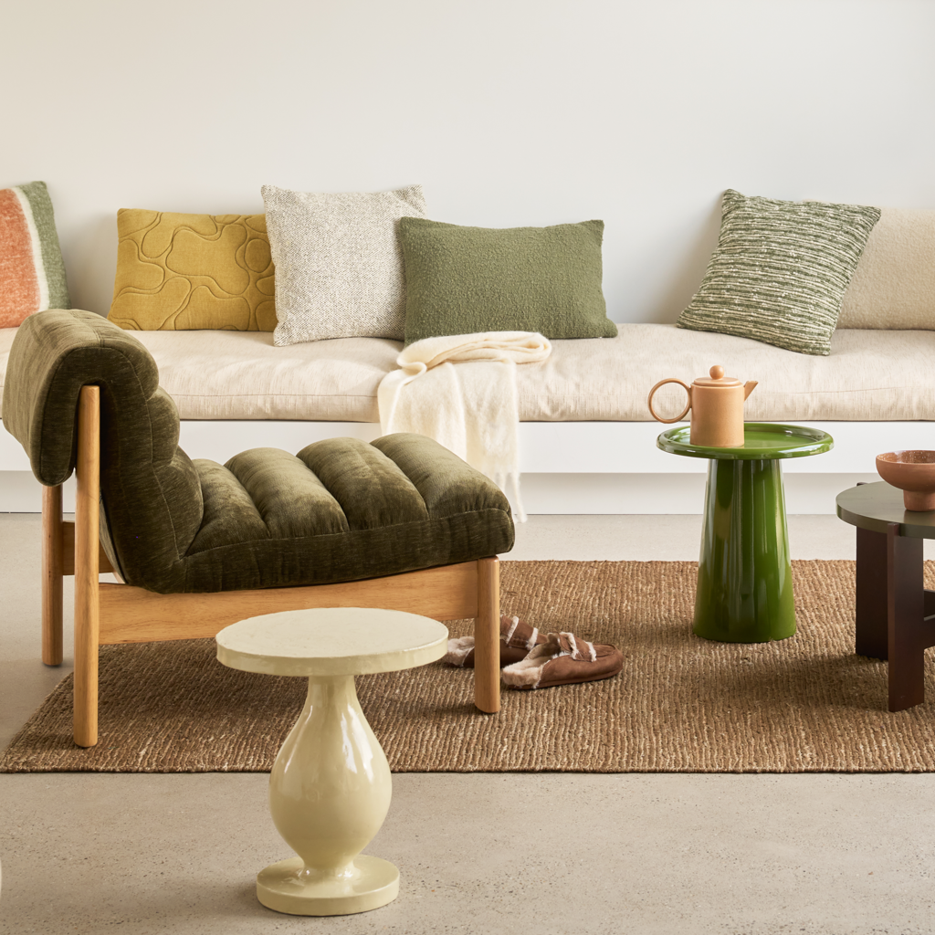 A modern side table with clean lines and a solid, bulky edge. Made of iron and in the vibrant banana palm colour that adds energy and character. Shiny finish.