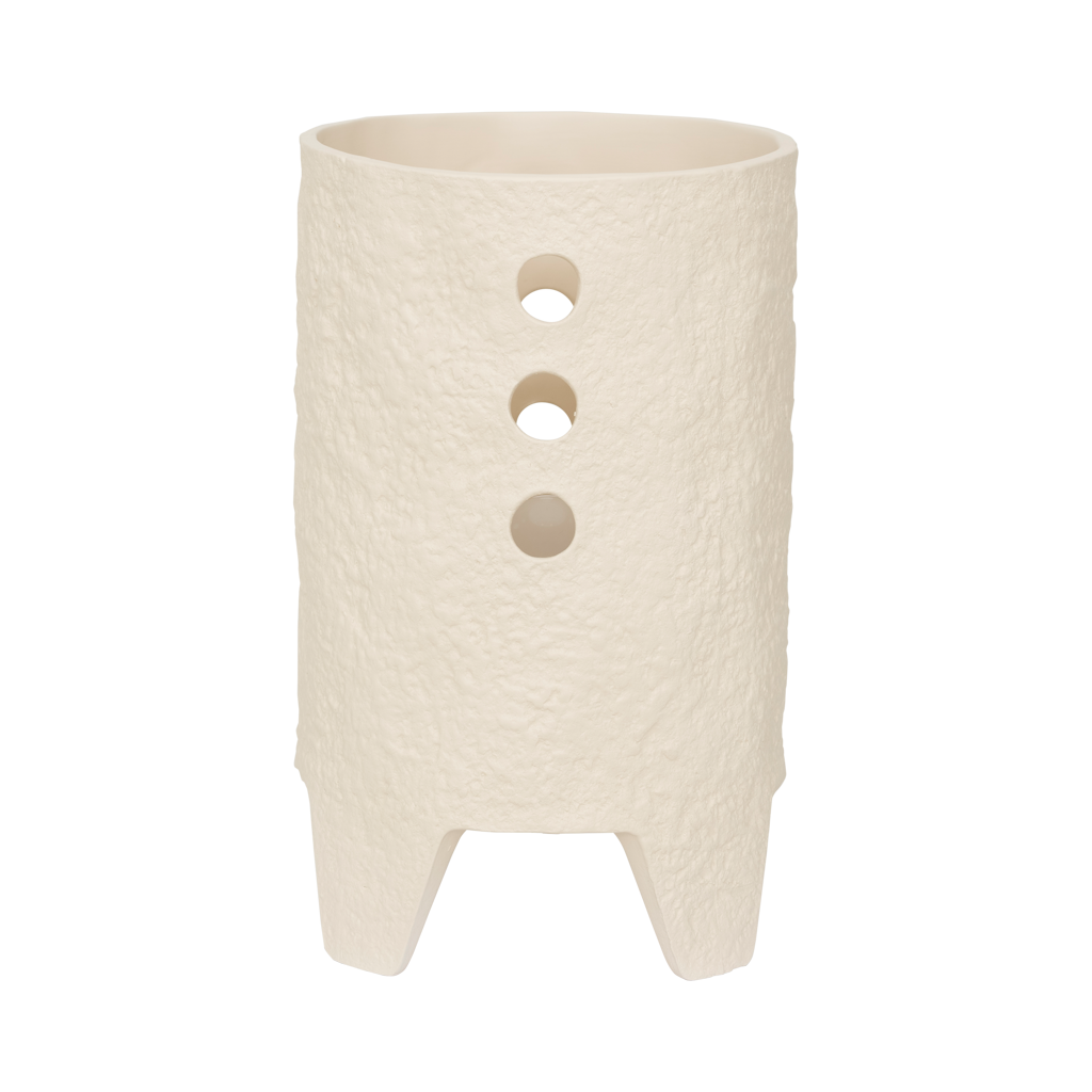 A textured and tactile ceramic table lamp in an handcrafted shape, in the soft colour almond milk. Its design brings expression but also calm, grounded presence.