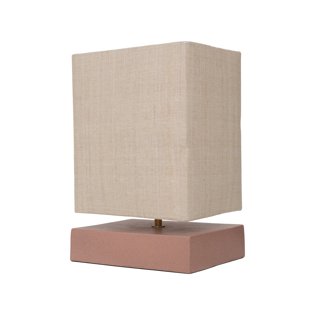 Table lamp with a rectangular beige linen shade and base made from a balanced mix of recycled and virgin ceramics. A minimalist, straight form, finished in matt rose smoke with a subtle speckle.
