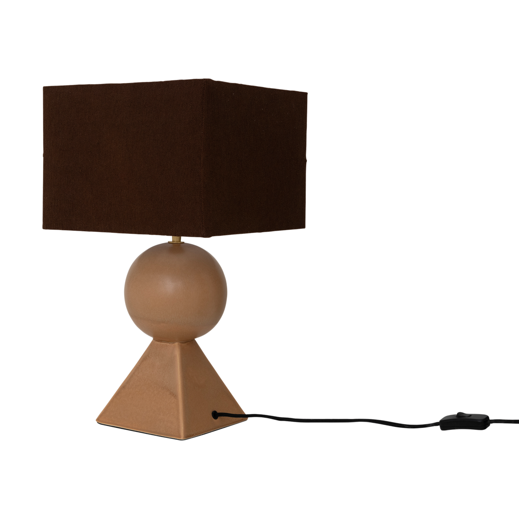 A lamp with a linen darkbrown shade, featuring a clean, modern silhouette formed by a pyramid and a sphere, finished in a mid-brown reactive glaze. Base made from a balanced mix of recycled and virgin ceramics.