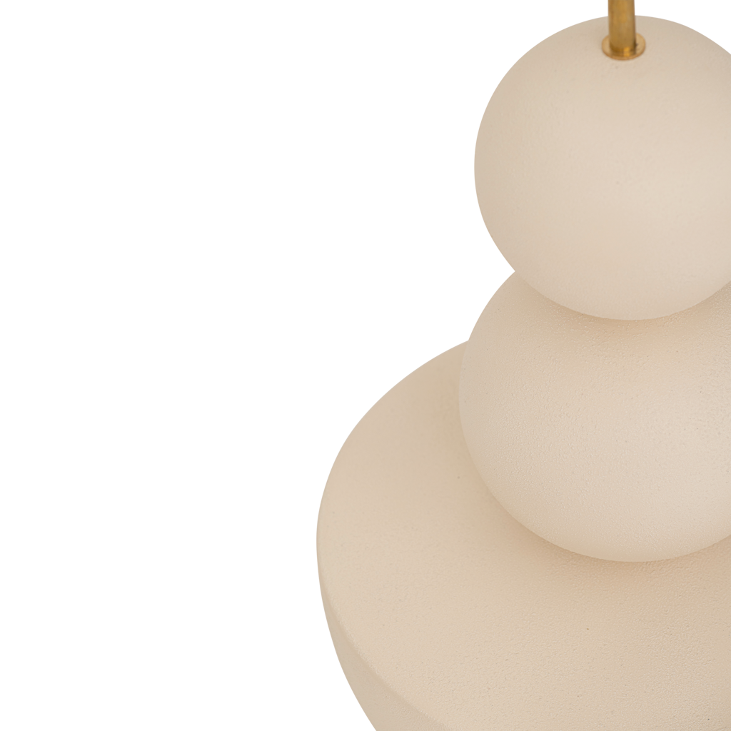 A very generous handmade minimalistic, sculptural table lamp in almond milk with an organic, stacked design and a sand coloured linen shade.