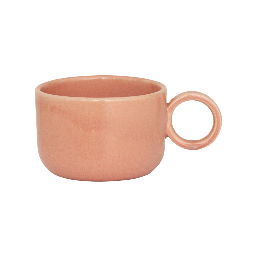 A ceramic mug in rose smoke in a reactive glaze with a large rounded handle, giving it a sculptural, contemporary look. Made from a balanced mix of recycled and virgin ceramics.