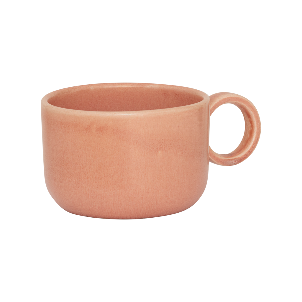 A ceramic mug in rose smoke in a reactive glaze with a large rounded handle, giving it a sculptural, contemporary look. Made from a balanced mix of recycled and virgin ceramics.