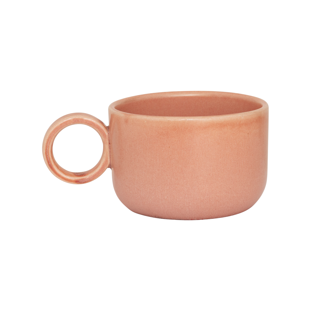 A ceramic mug in rose smoke in a reactive glaze with a large rounded handle, giving it a sculptural, contemporary look. Made from a balanced mix of recycled and virgin ceramics.