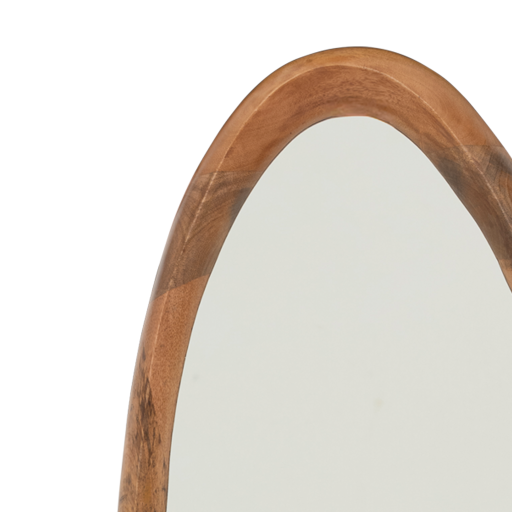 A large full-length mirror with an organic, flowing edge, matte finished in a warm golden oak colour. Hooks on the backside. Made of eco-friendly mangowood, of which the timber is harvested after the mango tree passed its fruit-bearing life span.