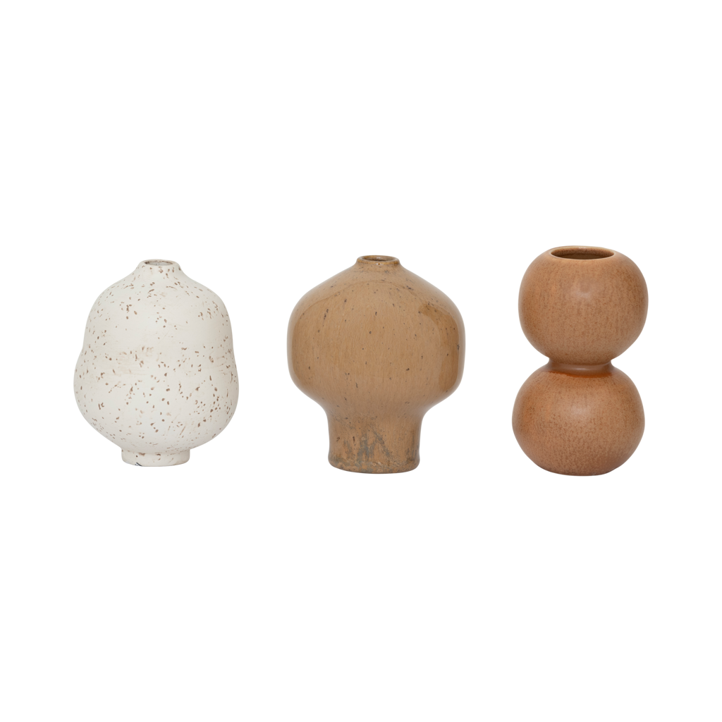 A set of three mini vases in natural tones. Reactive and textured glazes, each with its own organic, sculptural shape. Made from a balanced mix of recycled and virgin ceramics.