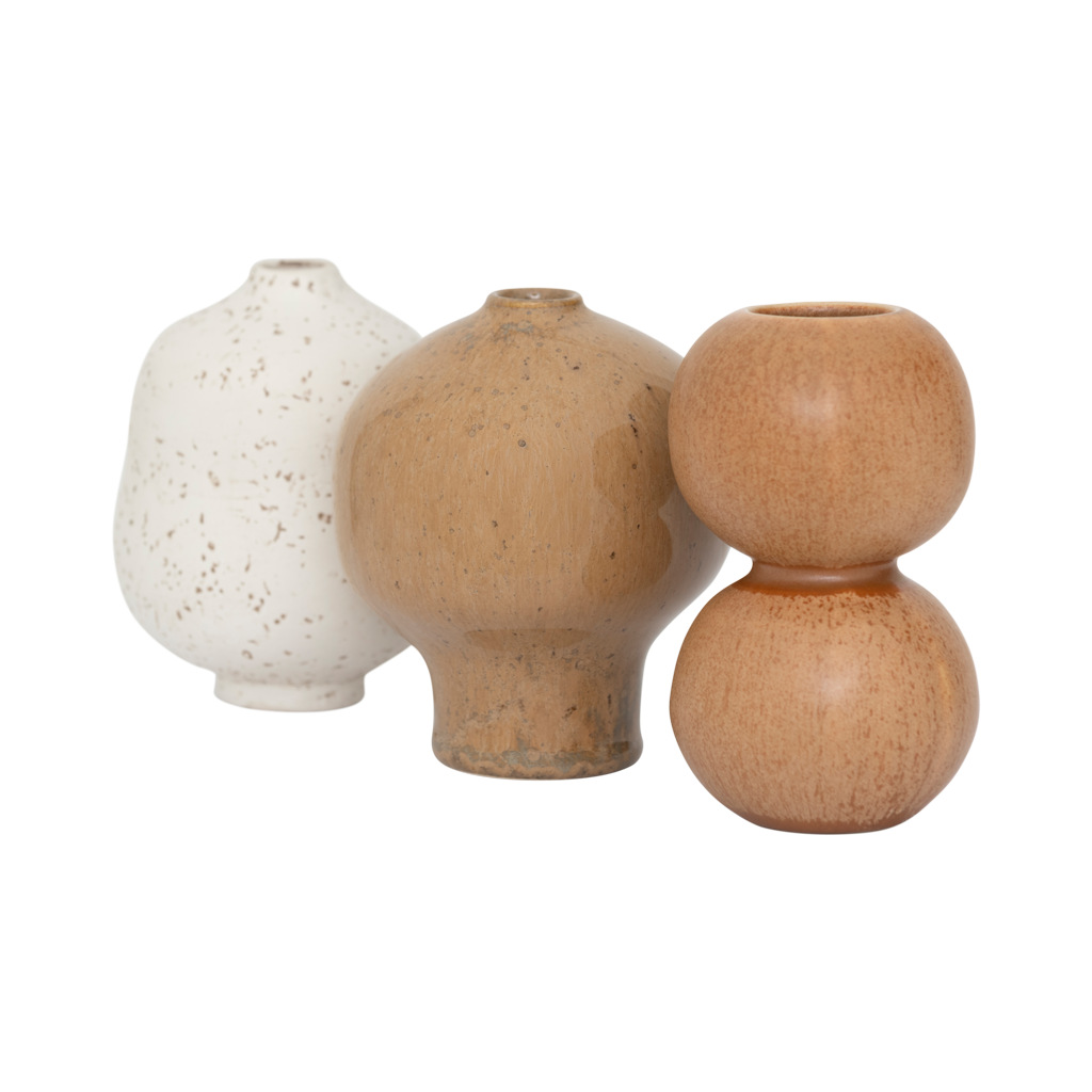 A set of three mini vases in natural tones. Reactive and textured glazes, each with its own organic, sculptural shape. Made from a balanced mix of recycled and virgin ceramics.