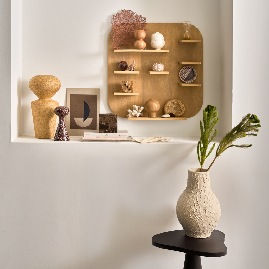 A set of three mini vases in natural tones. Reactive and textured glazes, each with its own organic, sculptural shape. Made from a balanced mix of recycled and virgin ceramics.