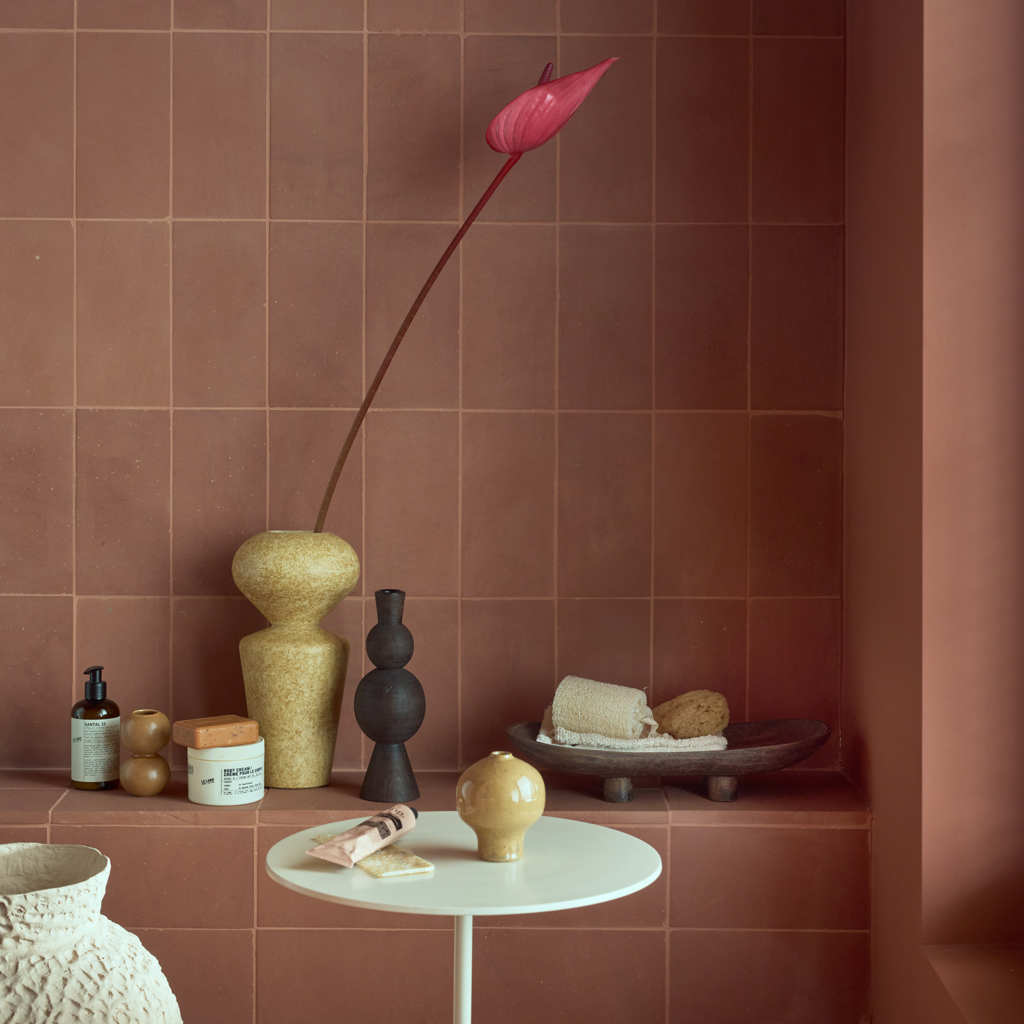 A set of three mini vases in natural tones. Reactive and textured glazes, each with its own organic, sculptural shape. Made from a balanced mix of recycled and virgin ceramics.