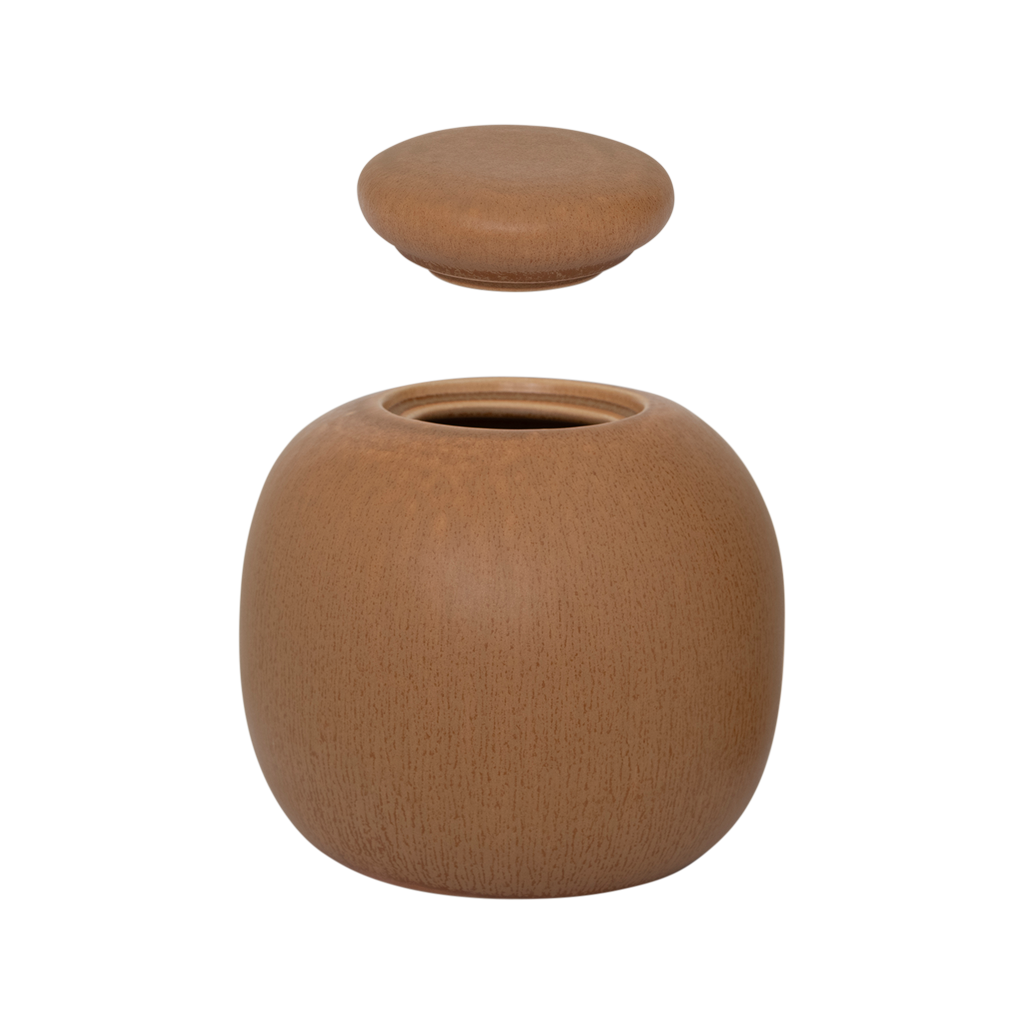 A round shaped storage jar with a gently rounded, substantial lid, finished in a inviting mid-brown matt reactive glaze. Made from a balanced mix of recycled and virgin ceramics.