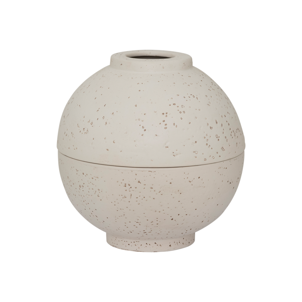 A spherical fragrance holder in off-white with a subtle textured skin, designed to store your whole fragrance bottle with an opening for scented sticks.