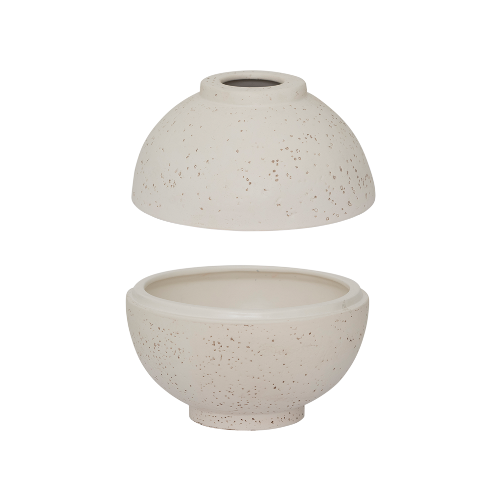 A spherical fragrance holder in off-white with a subtle textured skin, designed to store your whole fragrance bottle with an opening for scented sticks.