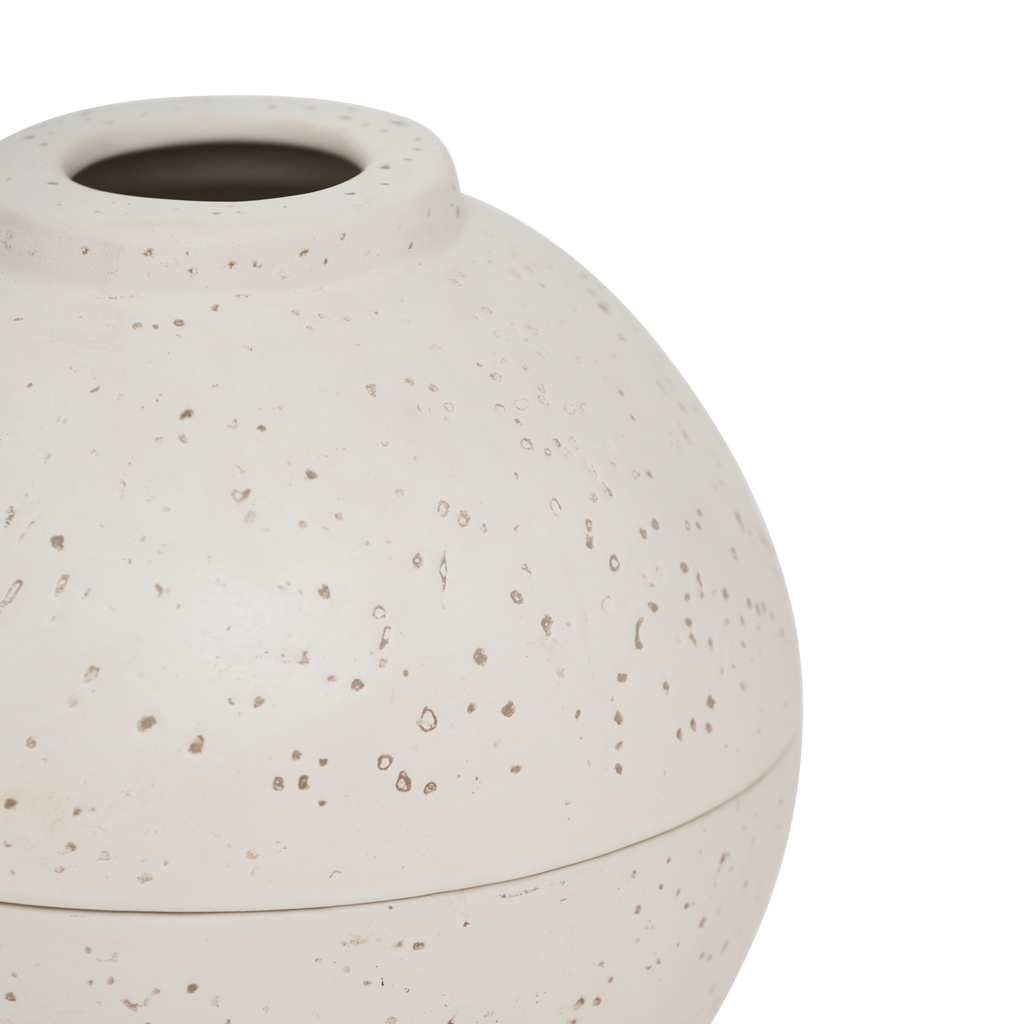 A spherical fragrance holder in off-white with a subtle textured skin, designed to store your whole fragrance bottle with an opening for scented sticks.